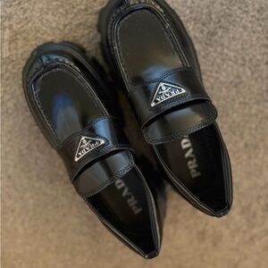 Prada women’s Glossy Black Slip-On Loafers